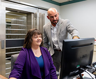 Two people at a desk