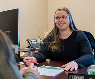 A bank employee sitting at a desk