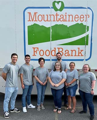 PCB Team members in front of Mountaineer Food Bank