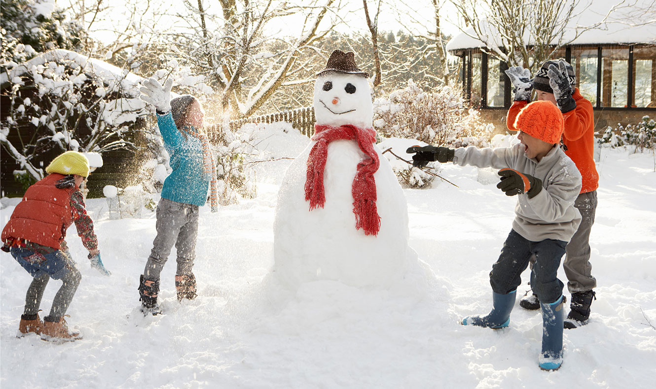 Kids building a snowman