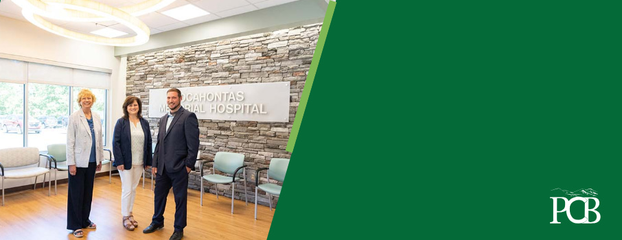 3 people standing in the new hospital addition.