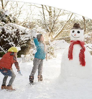 Kids building snowman