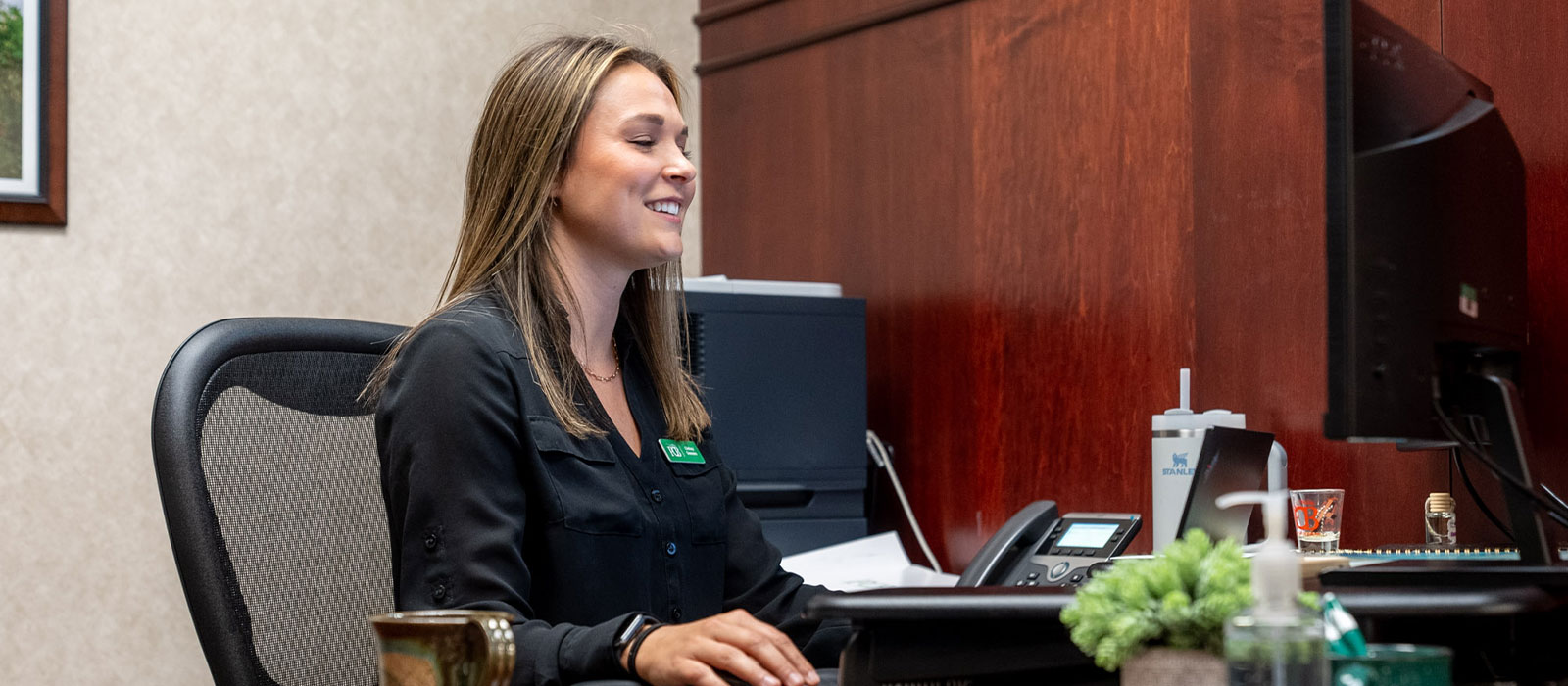 Person smiling at computer