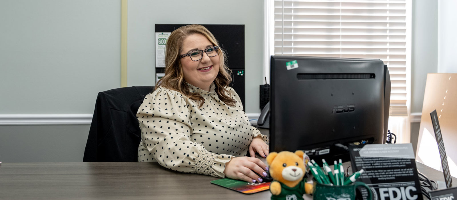 Smiling woman at desk