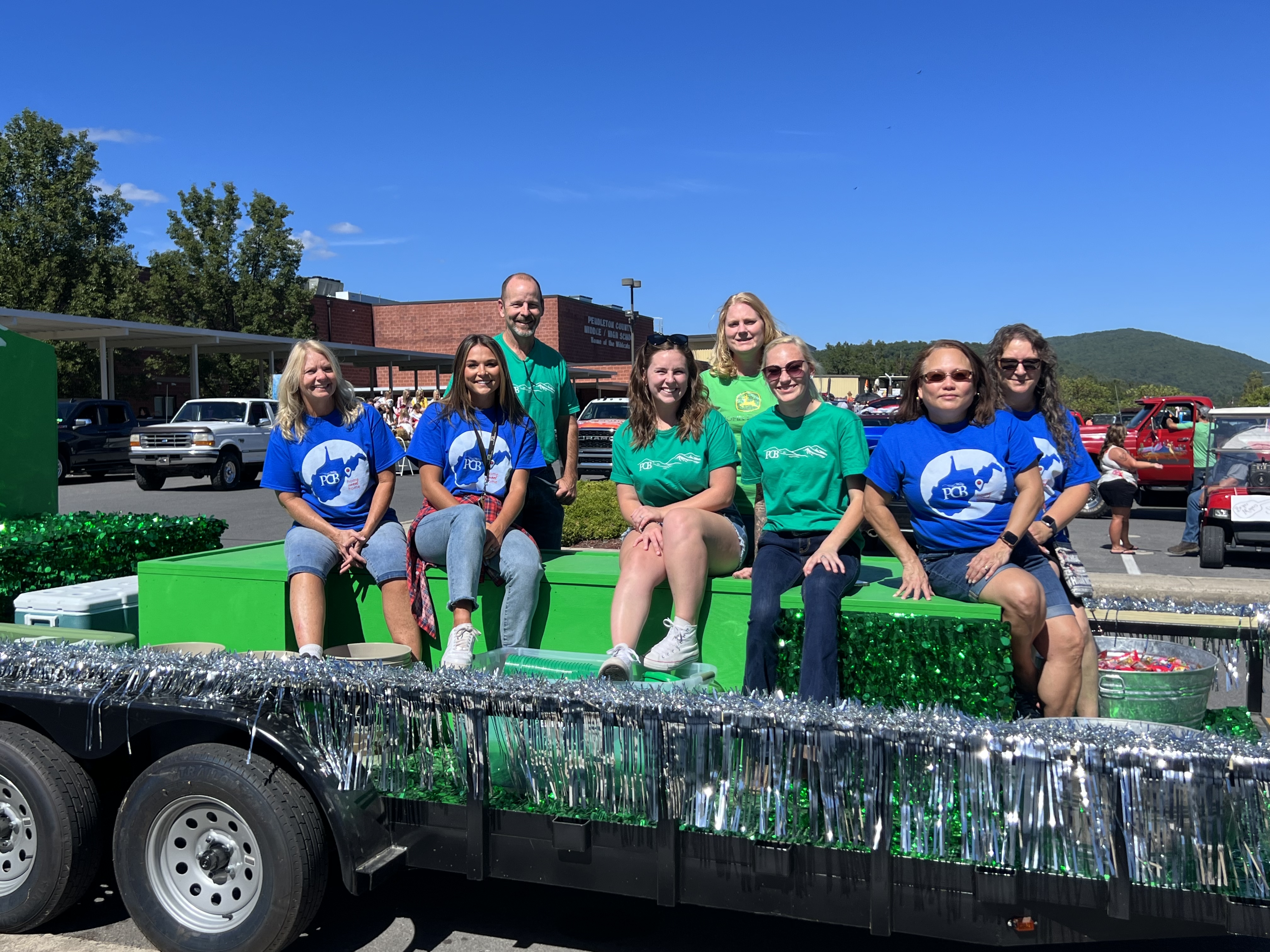 PCB employees on a parade float