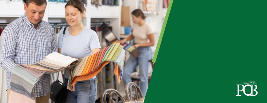 man and woman looking at fabric swatches