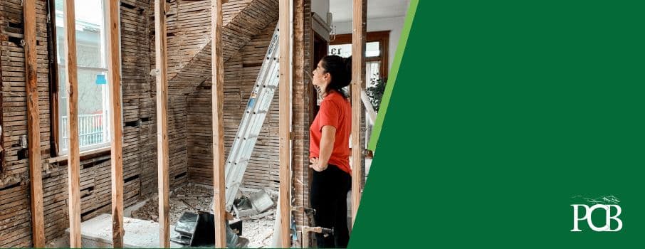 woman looking at home construction